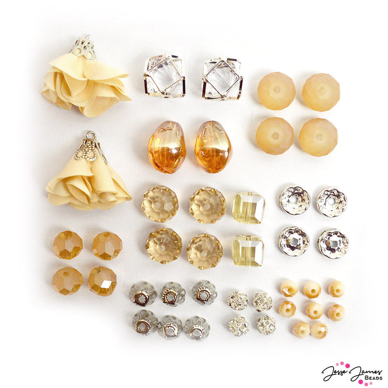 champagne beads from Jesse James Beads featuring faceted glass, caged crystals, bead caps, large tassels, and more.